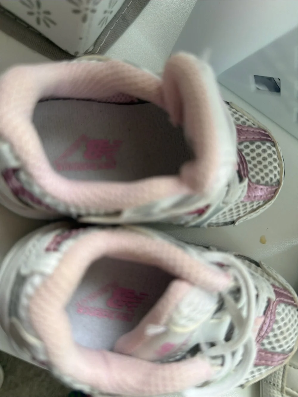 2 shoes . 1 New Balance White and Pink Kids Running Sneakers and 1 kurt geiger